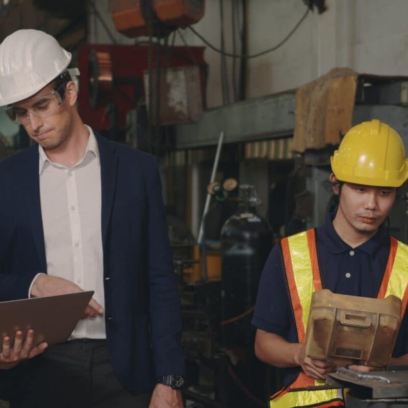 Engineering people discussing testing workflow using Jenkins in a CI/CD pipeline