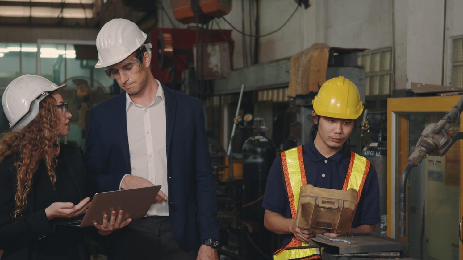 Engineering people discussing testing workflow using Jenkins in a CI/CD pipeline