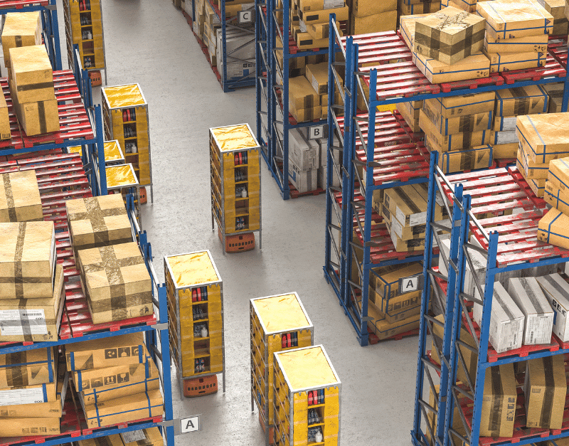 Warehouse shelves filled with various stacked boxes, organized by labels and colors.