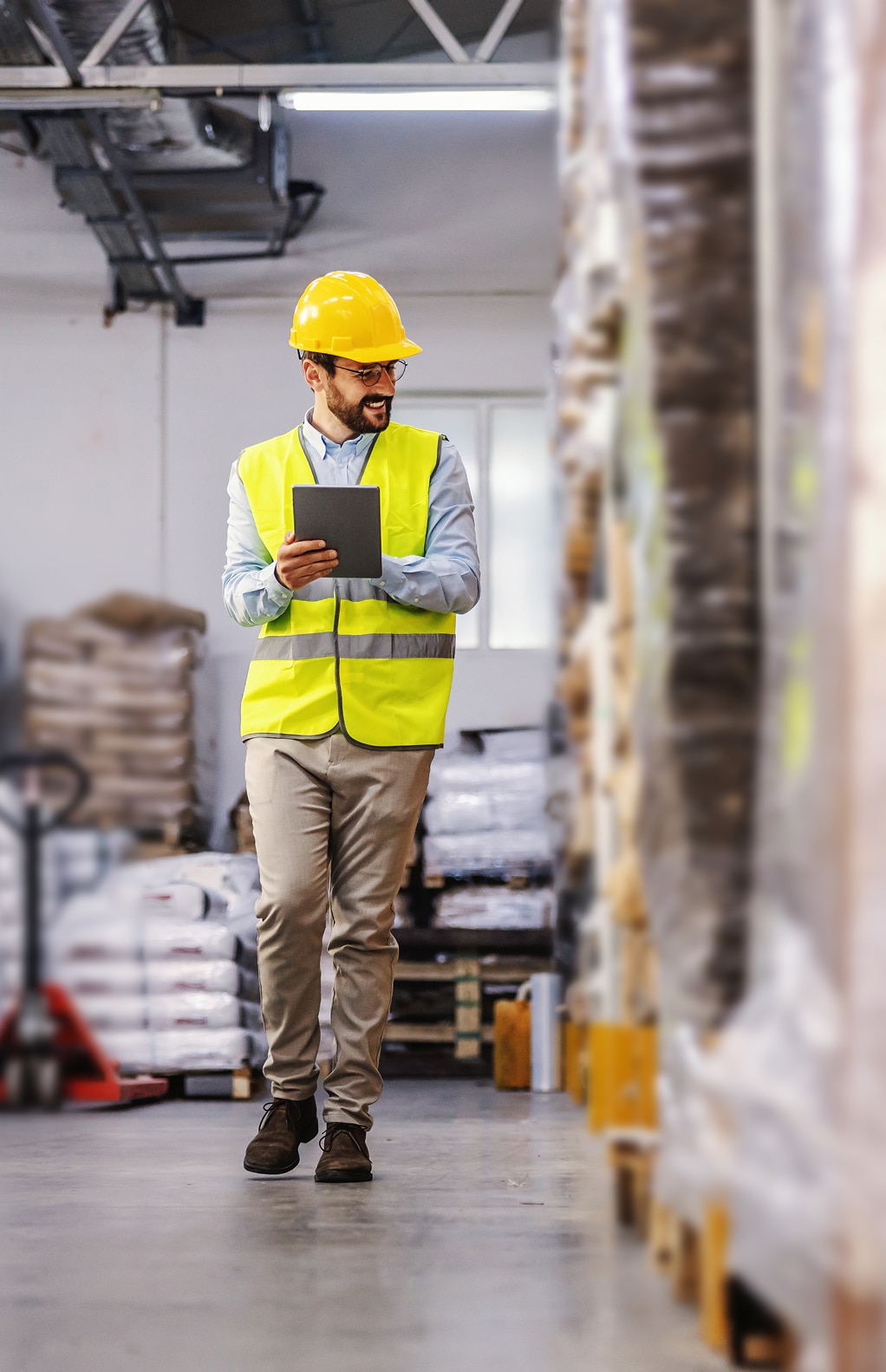 Warehouse worker using a tablet for supply chain test automation