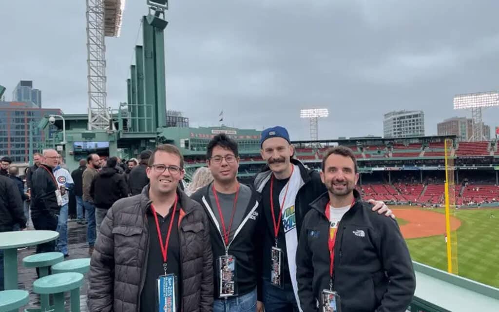 about-slider-14 Cycle Labs colleagues posing together at a baseball stadium